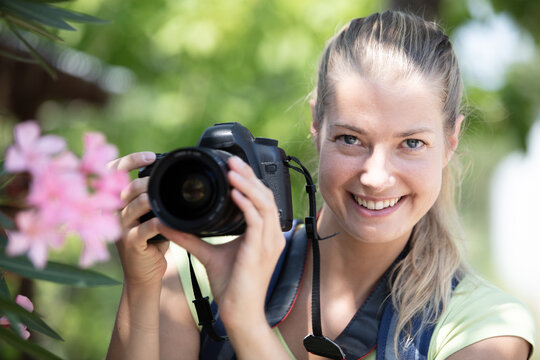 travelling woman taking pictures in nature