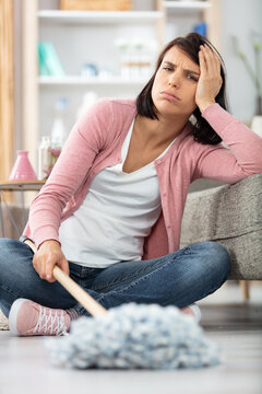 Young Woman Is Fed Up With Washing Floor