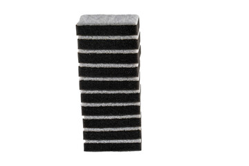 Black sponges with an abrasive bright white layer for washing dishes and other household or domestic needs.