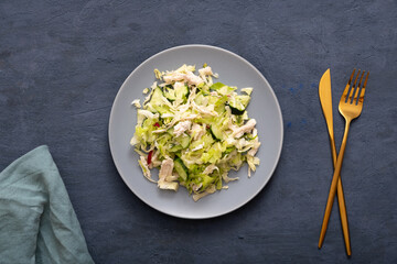 Top view salad of fresh vegetables and meat in a plate. The concept of healthy eating