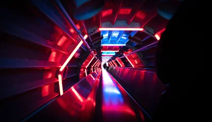 Deurstickers Going down an illuminated escalator © michaklootwijk