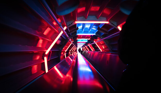 Going down an illuminated escalator
