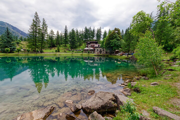View of Laux lake, small alpine lake near Usseaux, in Val Chisone, Piedmont, Italy