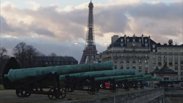 canons in the army museum with Eiffel tower in the background