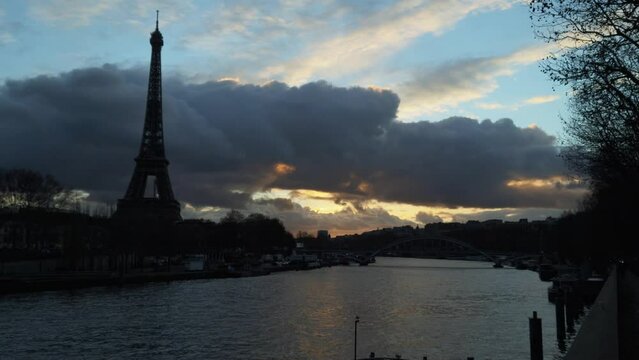 silhouette view of the Eiffel tower and the Seine river