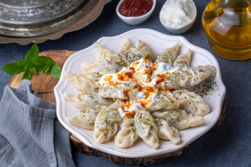 Georgian Dumplings Khinkali with Meat, Tomato Sauce and Spices / Hingel. (or Cerkes manti)