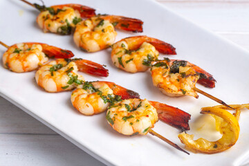 Skewered grilled shrimp with sauce