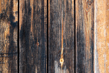 Old brown wooden background made of dark natural wood in grunge style. Copy space