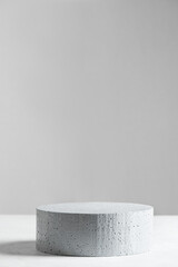 Empty stone podium on gray scene