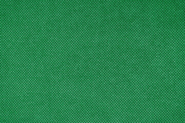 Texture background of velours green fabric. Fabric texture of upholstery furniture textile material, design interior, wall decor. Fabric texture close up, backdrop, wallpaper.