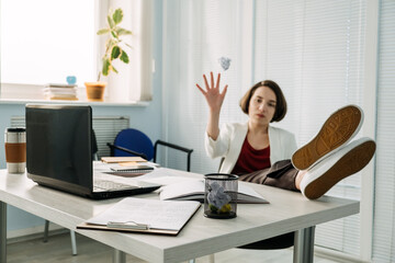 Job burnout, Tired businesswoman throws crumpled papers into bin on table