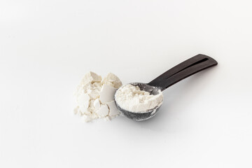 Whey protein powder on scoop. Fitness and gym diet nutrition