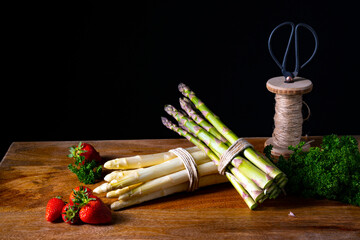 Green and white asparagus on the table