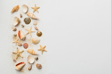 Summer time concept Flat lay composition with beautiful starfish and sea shells on colored table, top view with copy space for text