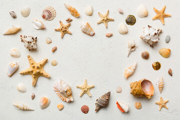 Summer time concept Flat lay composition with beautiful starfish and sea shells on colored table, top view with copy space for text