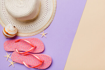 Summer vacation concept flat lay. straw hat beach accessories and flip flop top view. Space for...