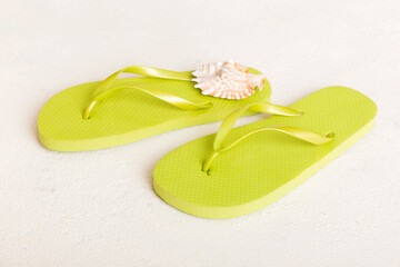 Beach accessories. Flip flops and starfish on colored background. Top view Mock up with copy space