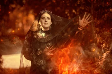 Fotobehang witch casts spells on fire © Andrey Kiselev