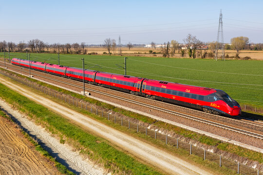 Italo ETR 675 Pendolino high-speed train of Nuovo Trasporto Viaggiatori NTV on the Milan - Bologna high speed rail railway line near Melegnano in Italy