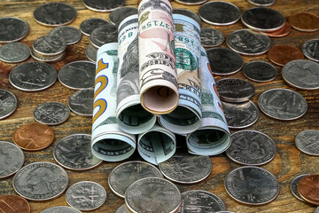 American dollars banknotes rolled into tube and us coins. Cash and saving of financial assets and home finance during economic crisis. - 509765174