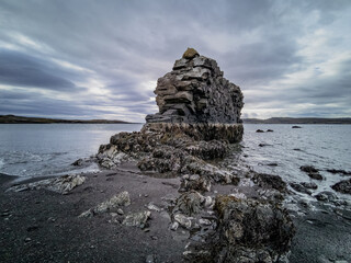 Fototapeta na wymiar Spectacular boulder to the fjord on low tide
