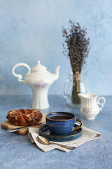 Coffee with bun and milk in jar, healthy breakfast