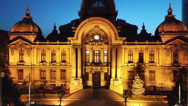 Aerial drone view of the CEC Palace at night in Bucharest, Romania. Illumination, buildings