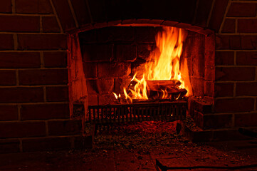 A warming fire in an open fireplace