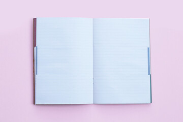 Notebooks on pink background. Top view