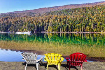 Three multi-colored plastic chairs