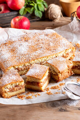 Apple pie slices (traditional Hungarian version) on rustic wooden background