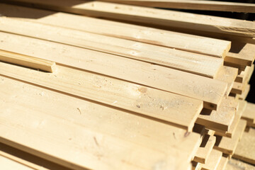 Boards in stock. White boards lie in stack.