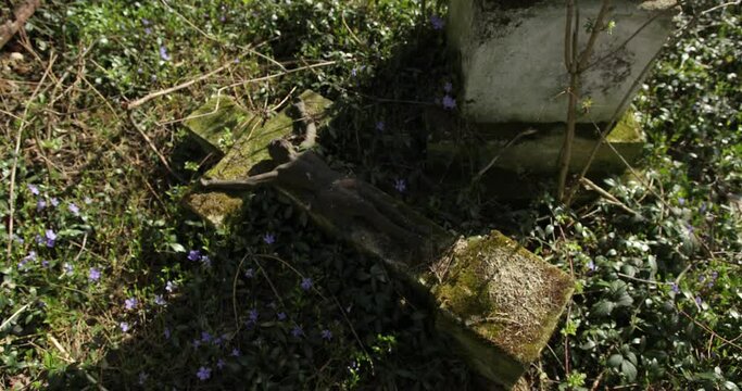 old abandoned graves in a Catholic cemetery. The rickety gravestones