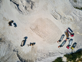 Aerial view trucks near quarry extraction porcelain clay, kaolin