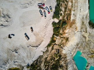 Aerial view trucks near quarry extraction porcelain clay, kaolin - obrazy, fototapety, plakaty