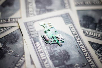 Circuit board on banknotes. Increasing the cost of electronics