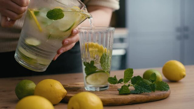 Close up of woman making lemonade in the kitchen. Shot with RED helium camera in 4K.  