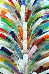 close up of colorful straws in glass