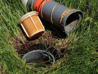 Fototapeta premium Cleaning debris from the sprinkler filter before the summer watering season