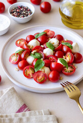 Salad with mozzarella, tomatoes, nuts and basil. Healthy eating. Vegetarian food. Diet.