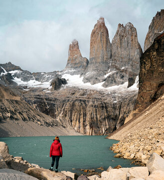 Mirador Las Torres, Torres Del Paine National Park, Patagonia, Chile. A girl with red jacket, alone in the wild, mountain girl, road to mountains.