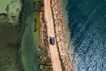 Aerial view of an off-road vehicle on an expedition through a lagoon (Amvrakikos Wetlands National Park) © Daniel Beckemeier