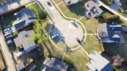 Aerial view two story single family houses neighborhood with cul-de-sac, parked cars on street and...