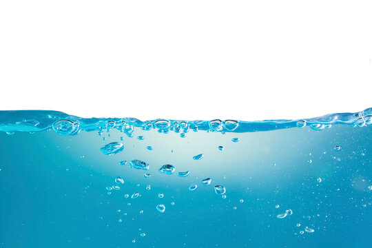 Water waves cause bubbles and splatter in clear blue water