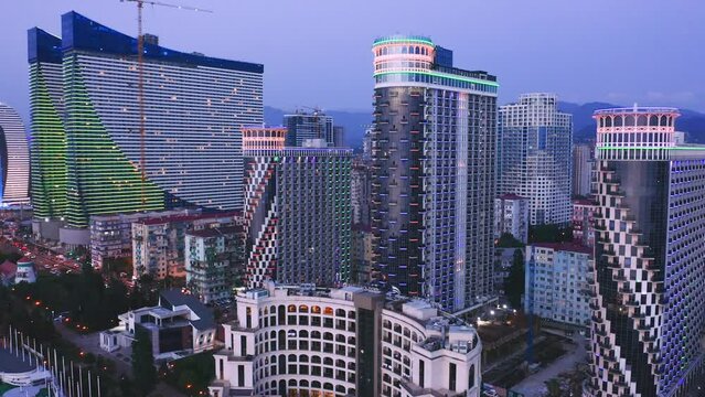 Drone View Of Illuminated Apartment Skyscrapers At Evening Dawn