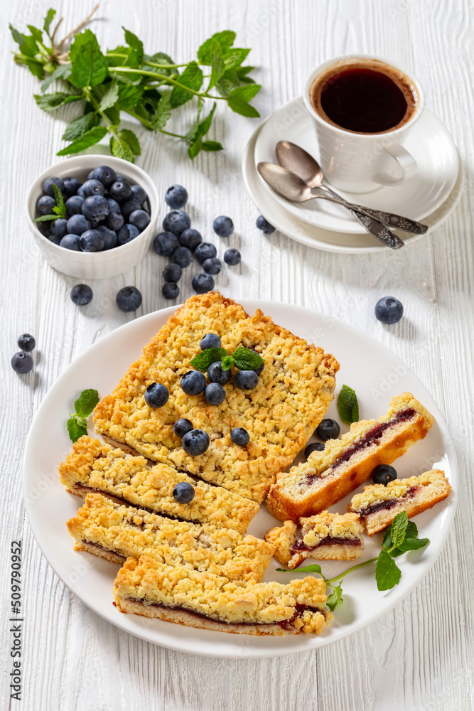 Wall mural sliced blueberry crumble pie on plate, top view