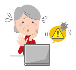 サポート詐欺のセキュリティ警告画面が出て、慌てる高齢者
