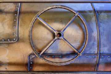 The element of the steel door of the ship with a round pulley or a forbidden hatch. Decor in the interior.Vintage background