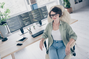 Portrait of attractive cheery skilled girl expert technician coder designer web developer sitting...