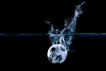 Football ball in water . Mixed media